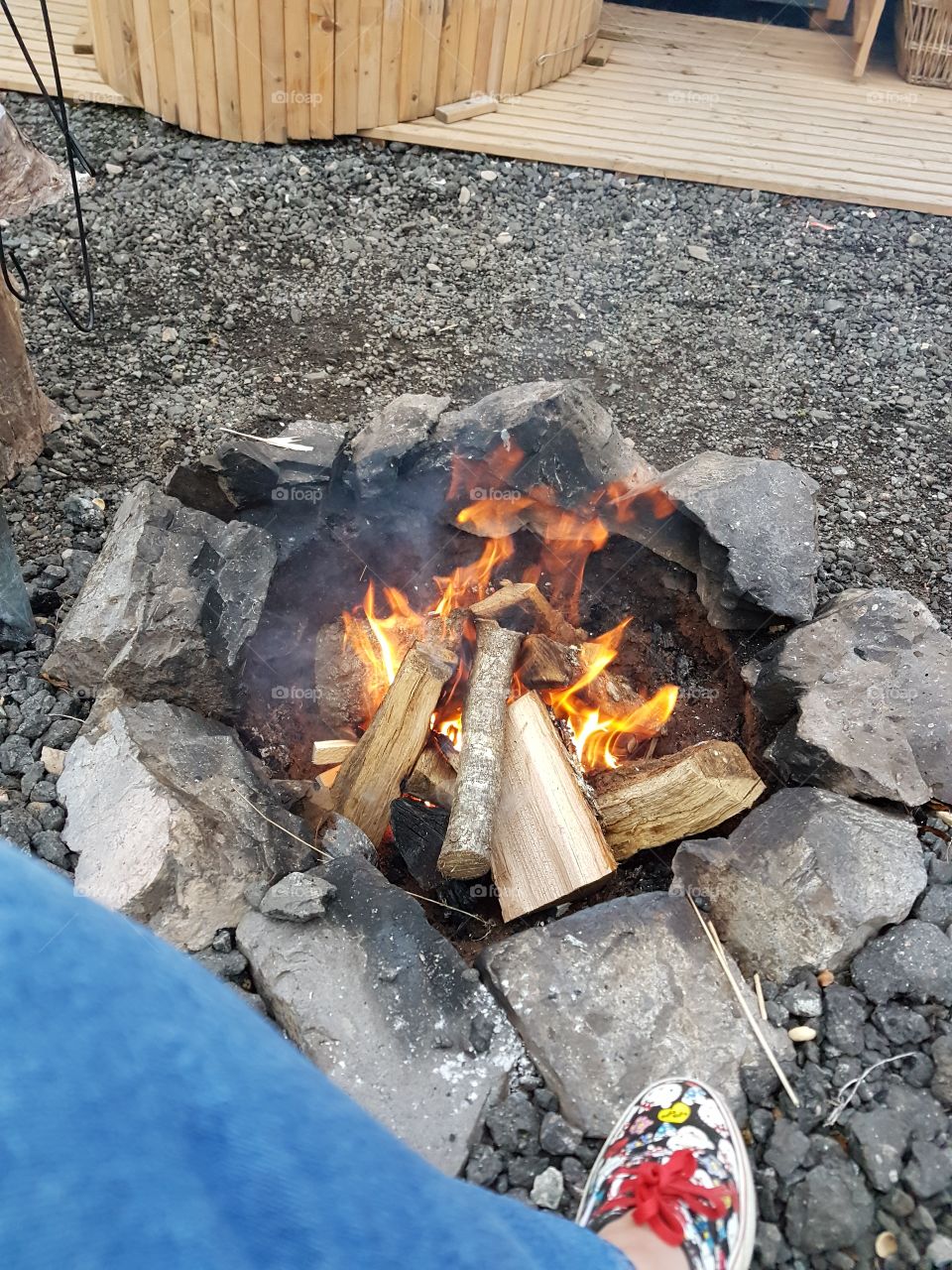 A campfire with wooden logs