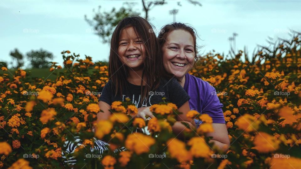 Mom & Daughter among flowers