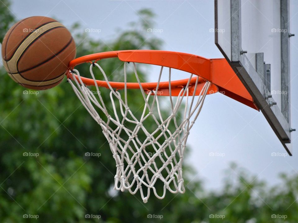 Basketball near hoop