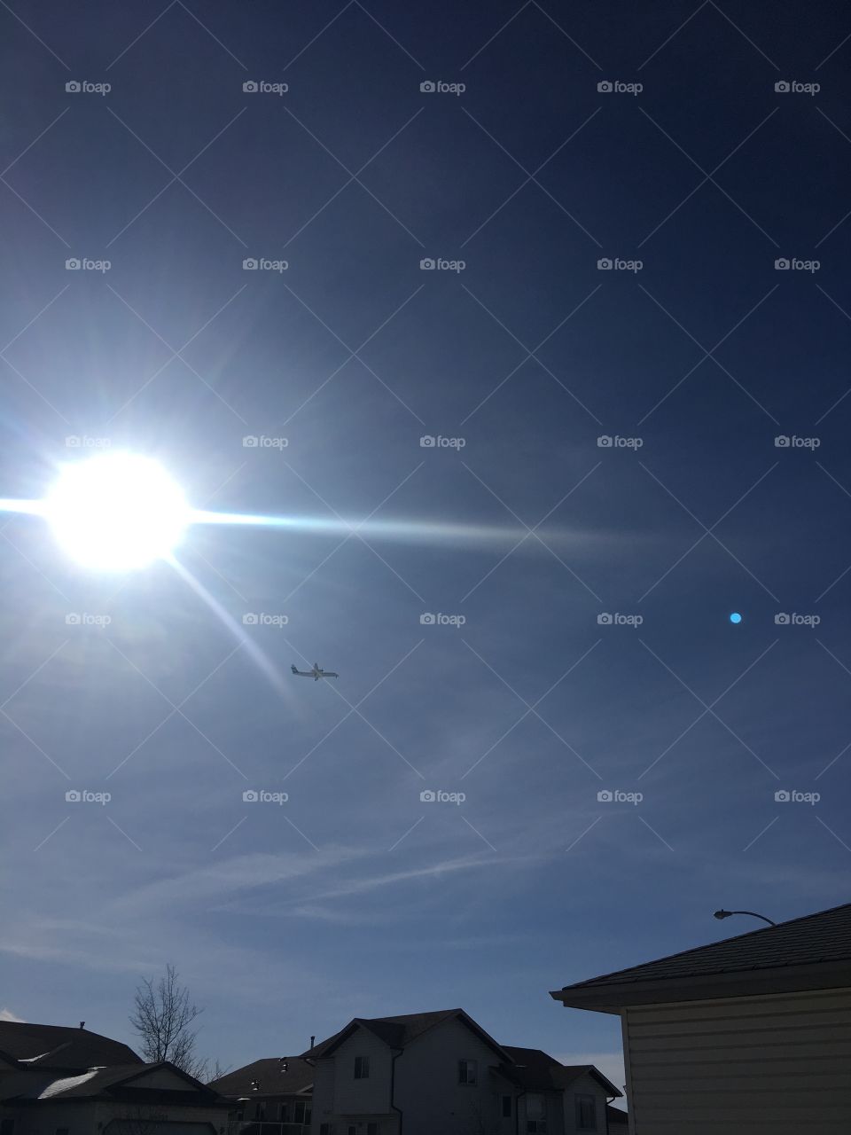 Airplane flying over the house 