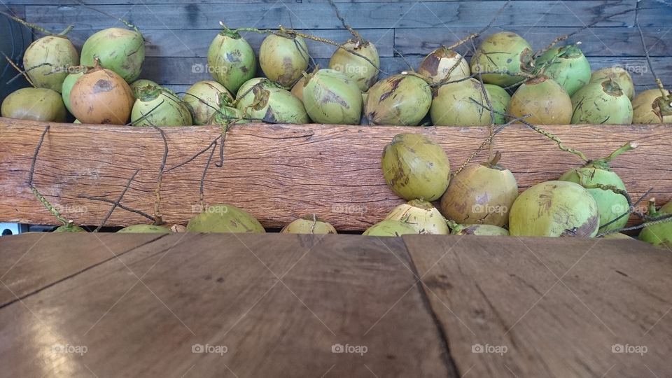 a lovely bunch of coconuts in an open market in Bali