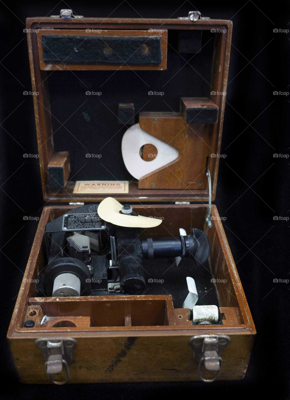 antique sextant in wood case