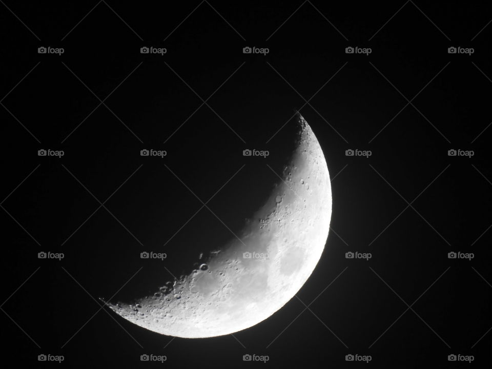 Close-up of crescent moon at night