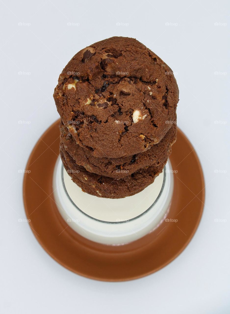 birds -eye view of sets of cookies and milk