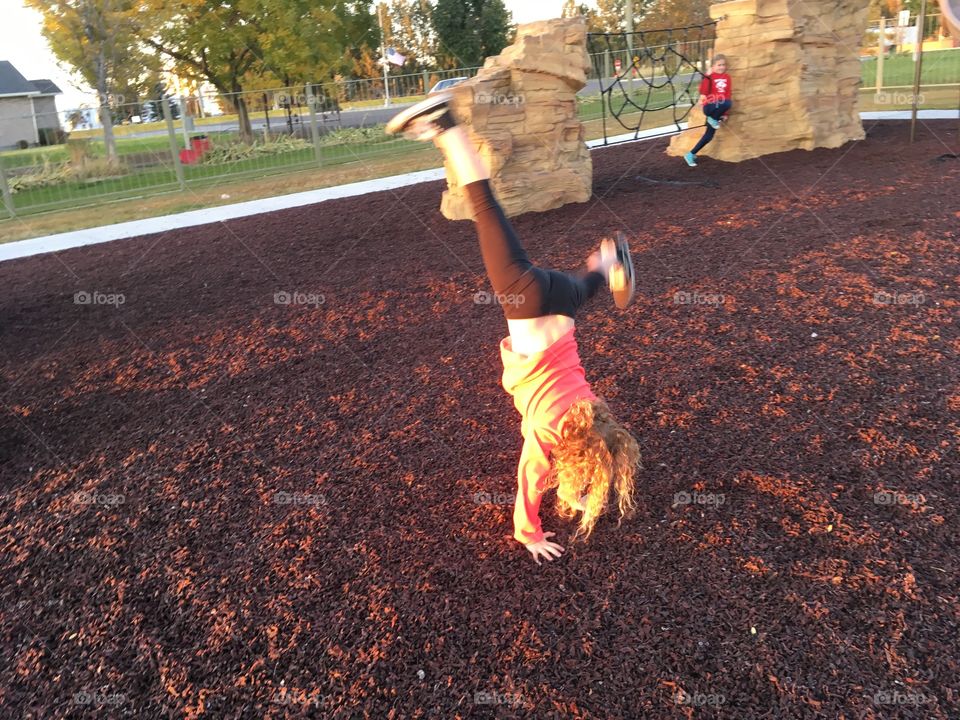 Cartwheels in the evening at the park.