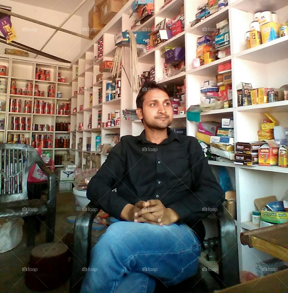 a boy sit our hordwear shop in India.....