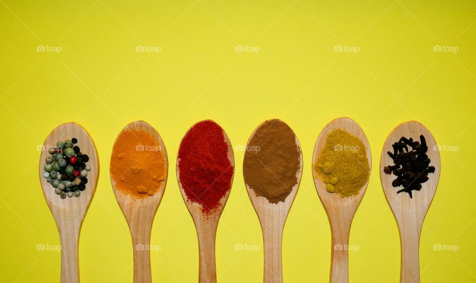 wooden spoons with different spices