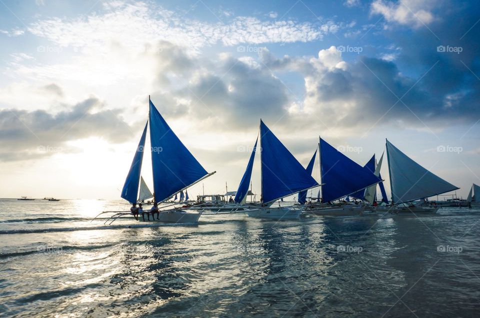 Scenic view of sail boats on idyllic sea