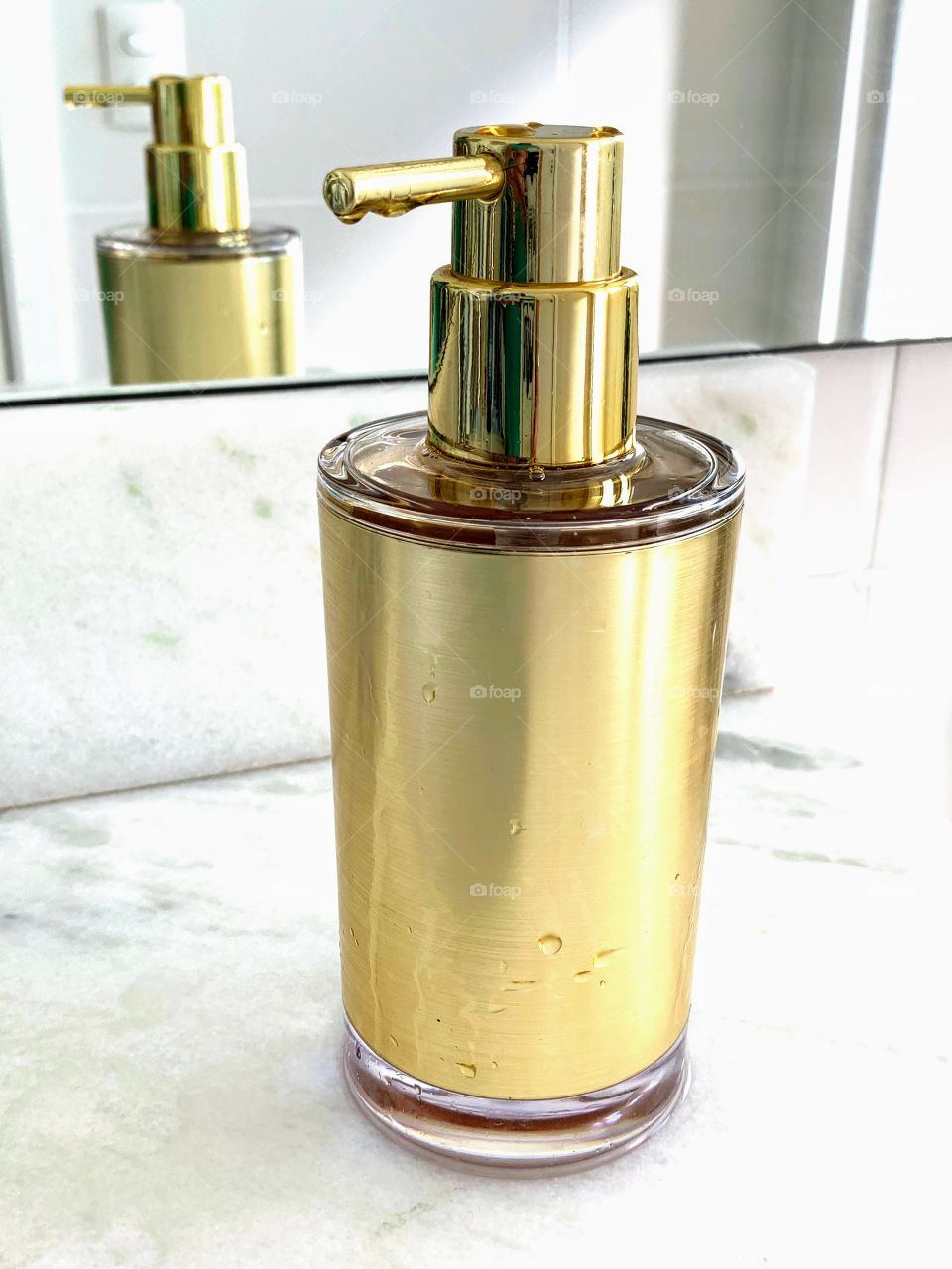 golden bottle in the bathroom sink