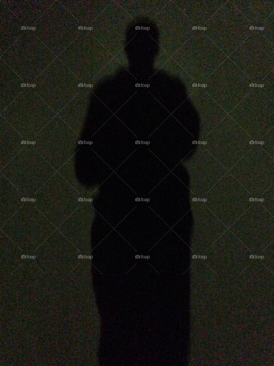 Shadow man on street in night 