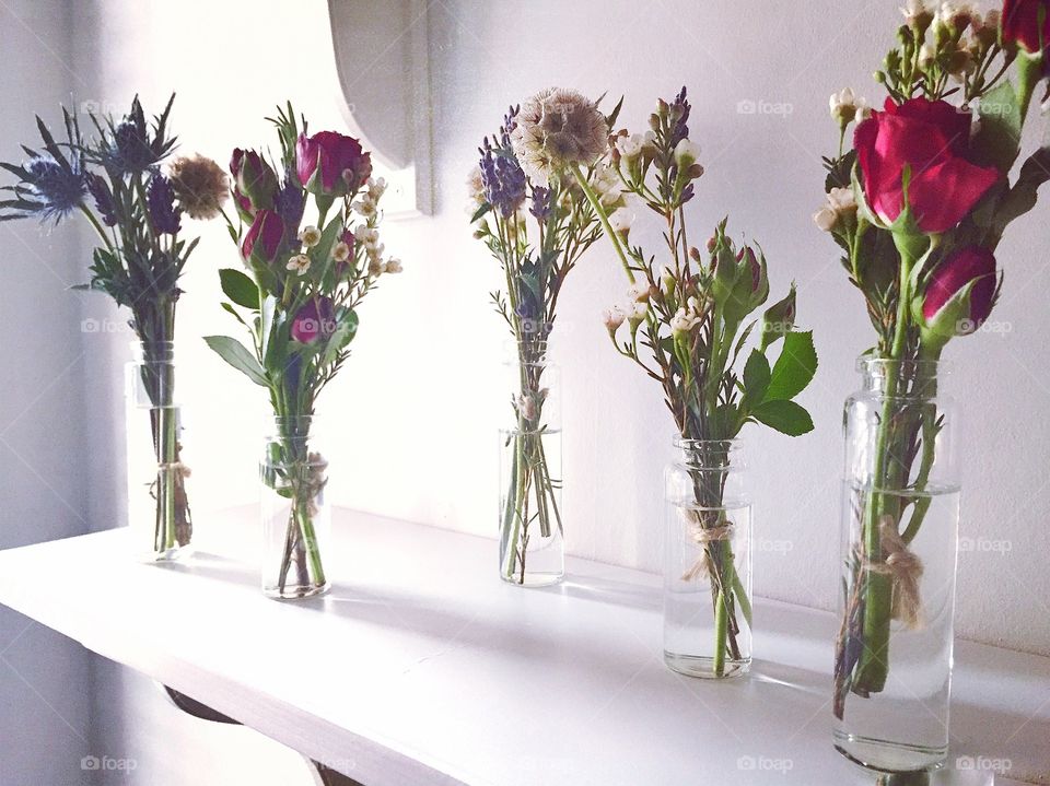 Red flowers on shelve