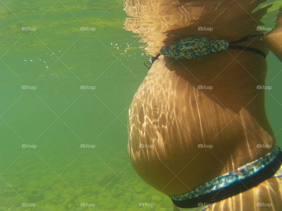 underwater picture of baby hump