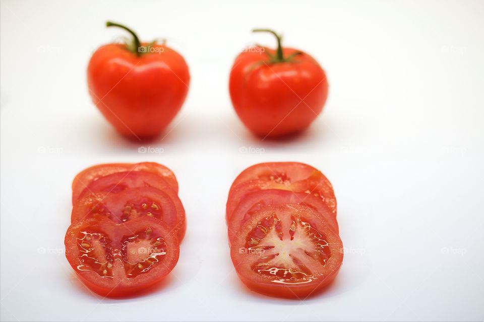 Tomatoes on white background