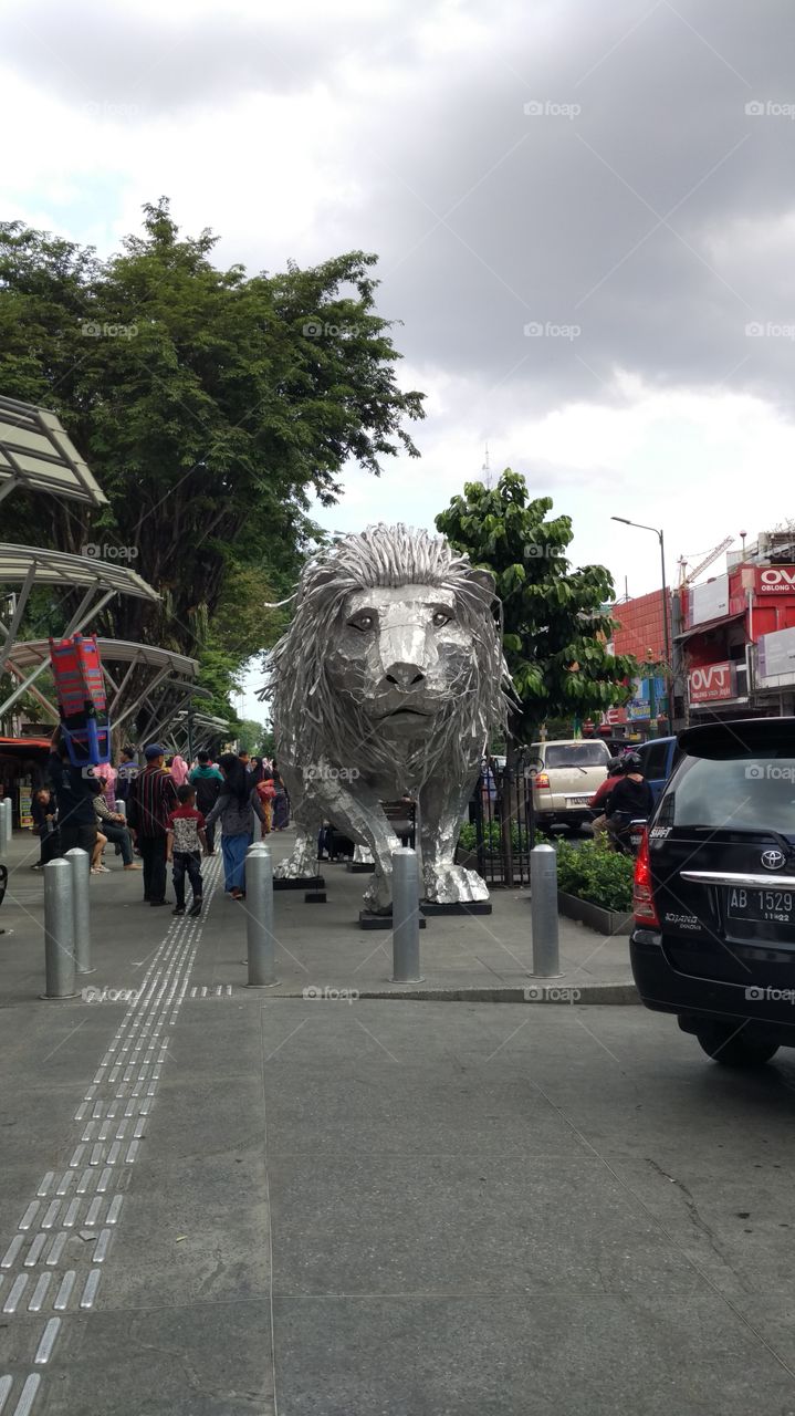 lion statue in the city crowd