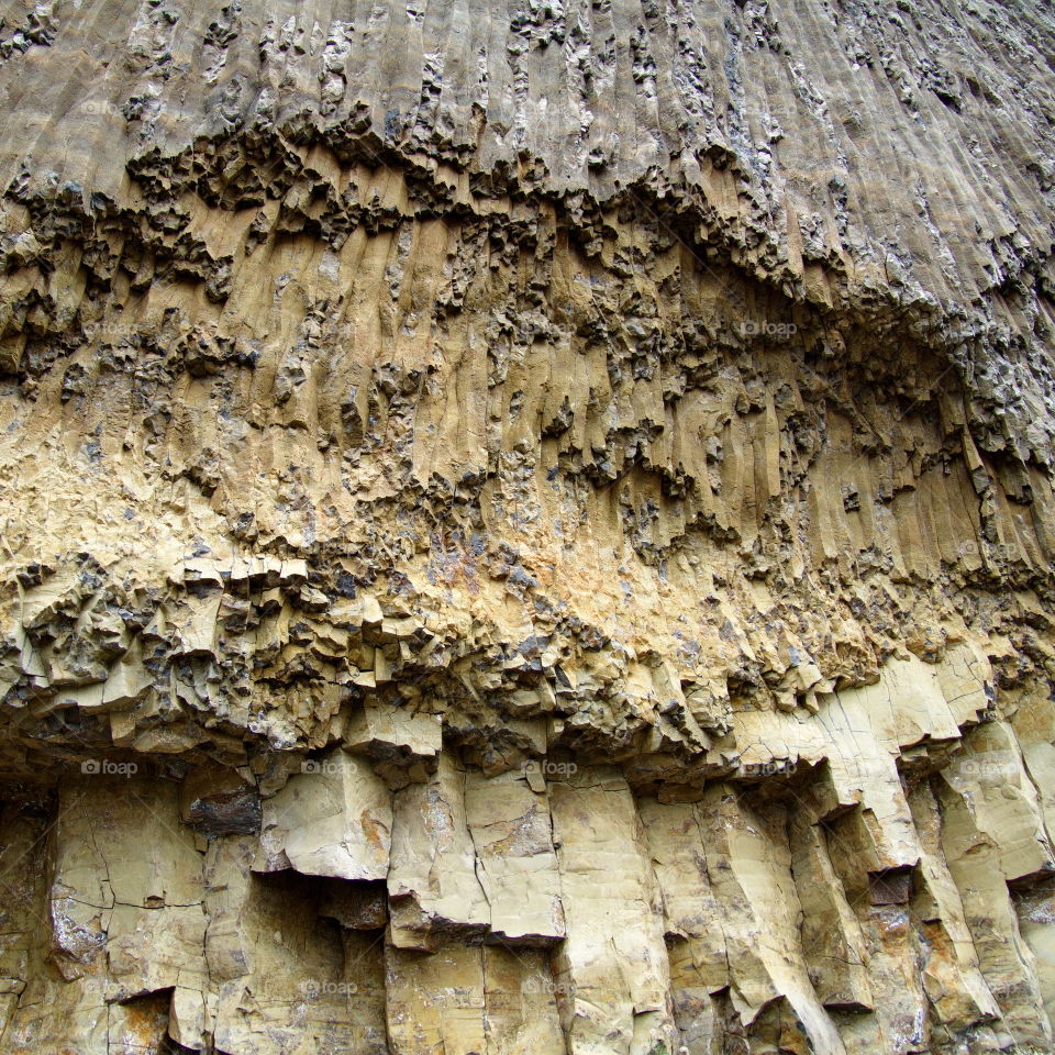 Jagged and textured rock cut away from a mountain side in Wyoming. 