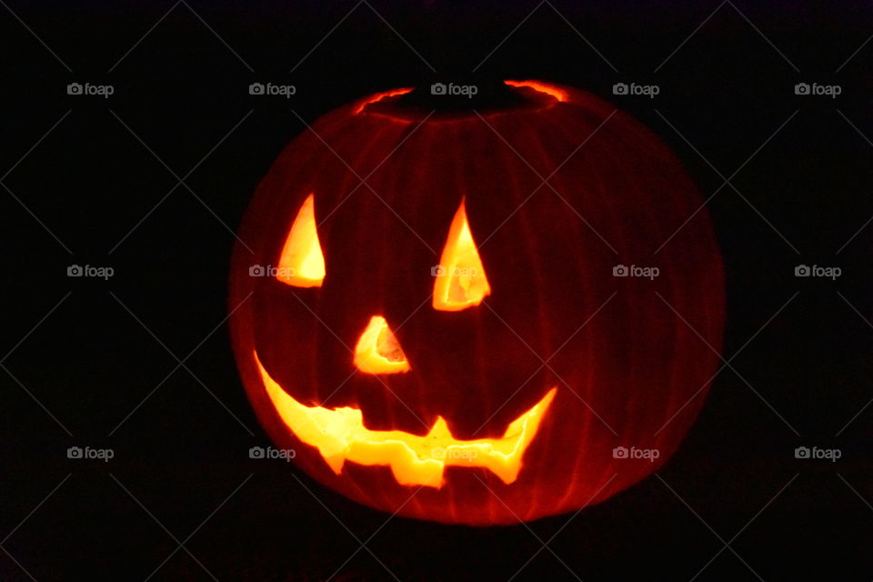 lit up halloween pumpkin at night