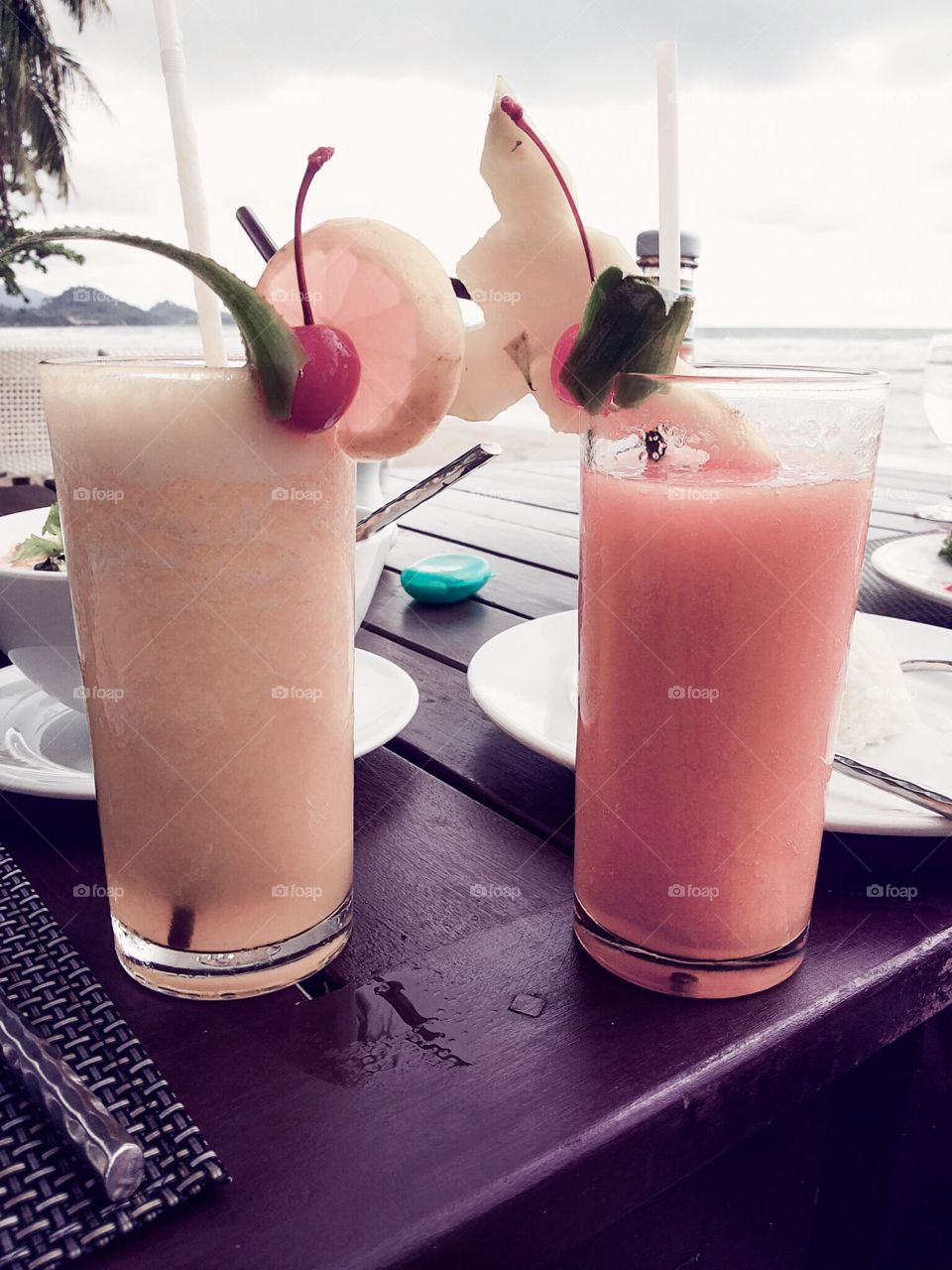 Drinking juice at the beach