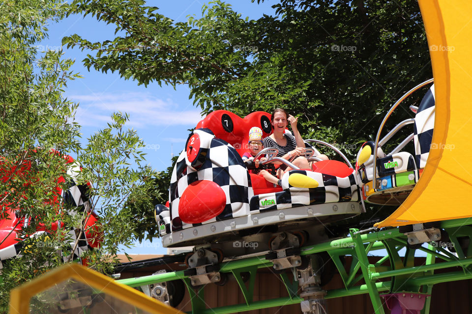 Sisters enjoying a ride at the theme park