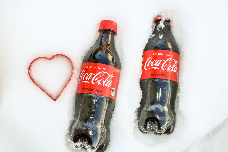 CocaCola- two with heart in the snow.