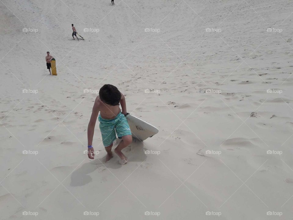 Sandboarding in Joaquina Dunes in Florianopolis, Brazil