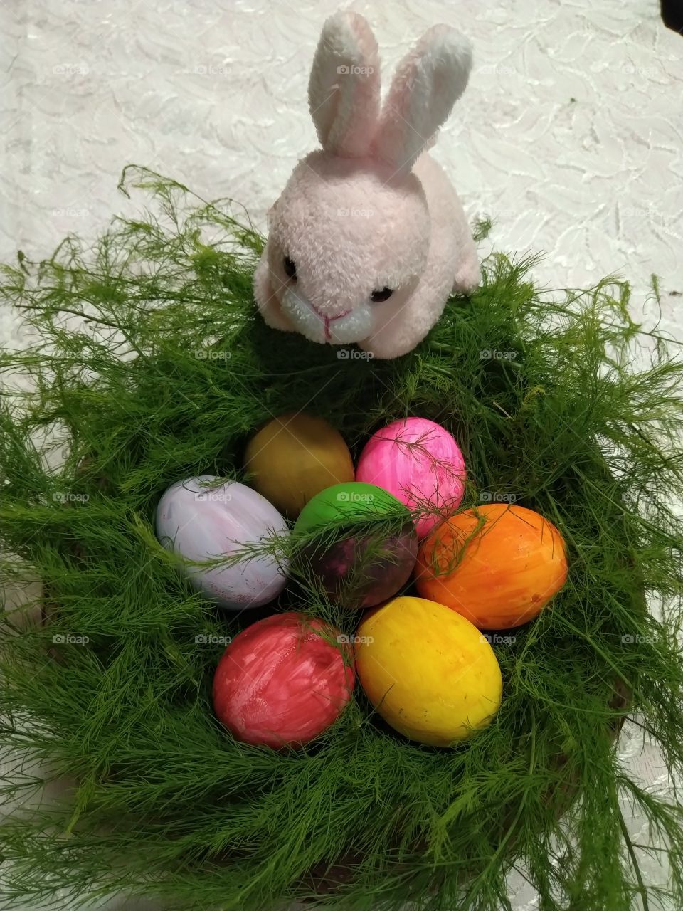 a colourful easter eggs with little pink cute bunny