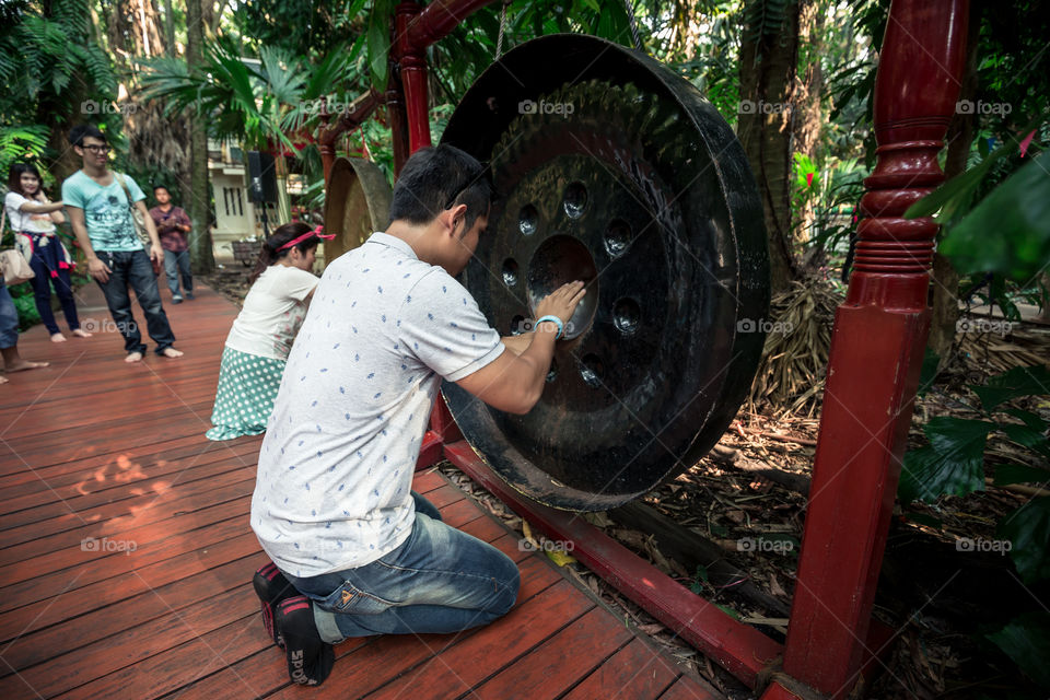 Man touch the gong