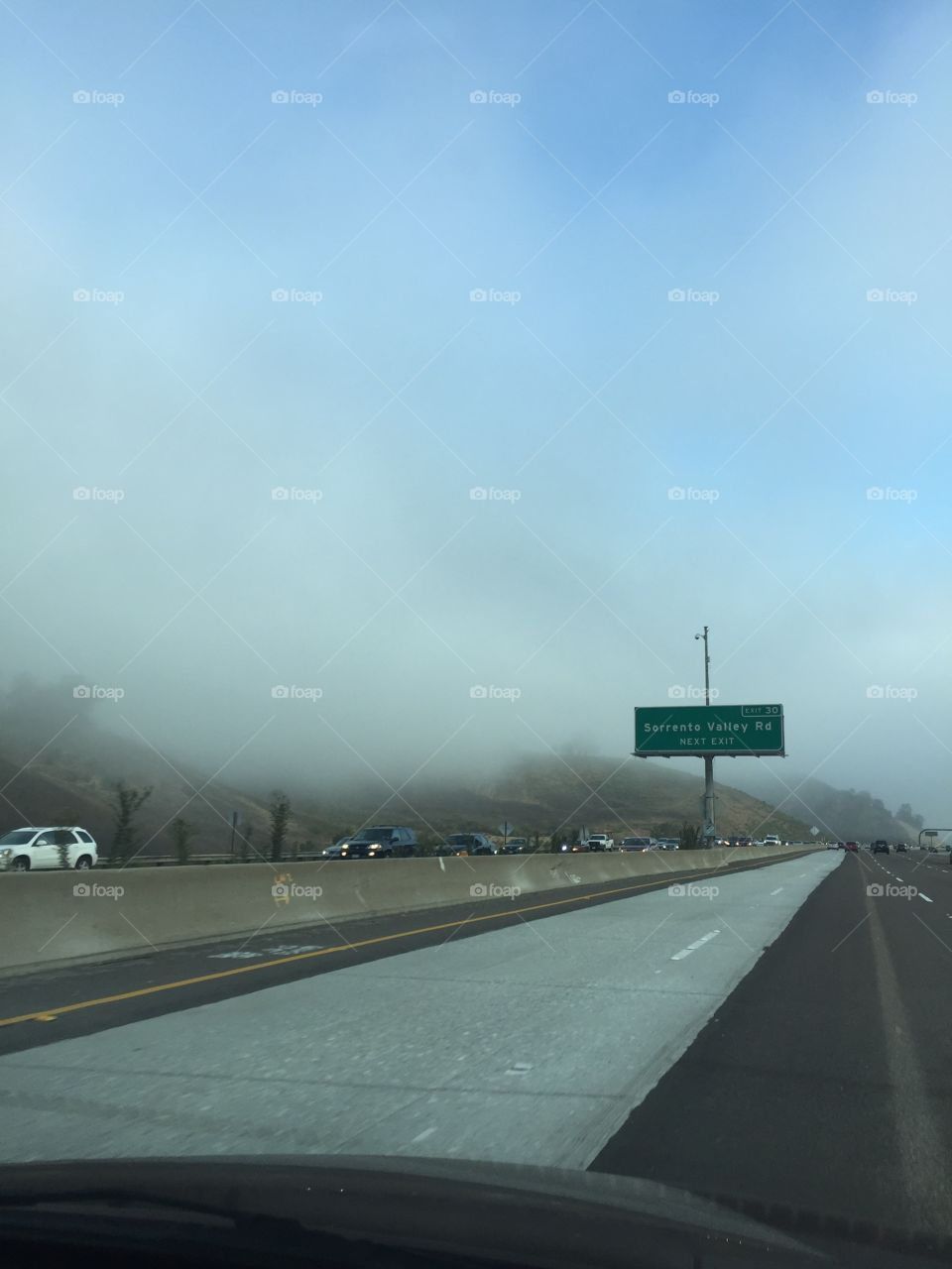 Engulfed by marine layer. Driving  through fog on a beautiful morning.