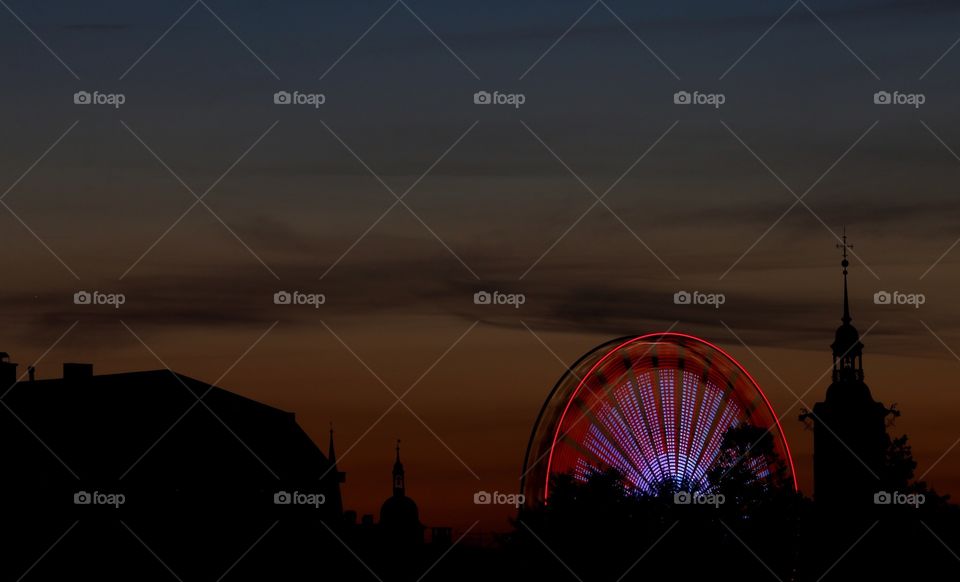 View of a ferris wheel during sunset