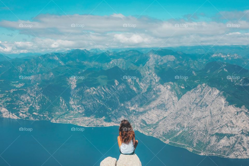 A lady enjoy beach brezzes