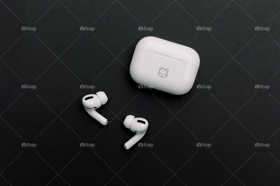 AirPods on black background