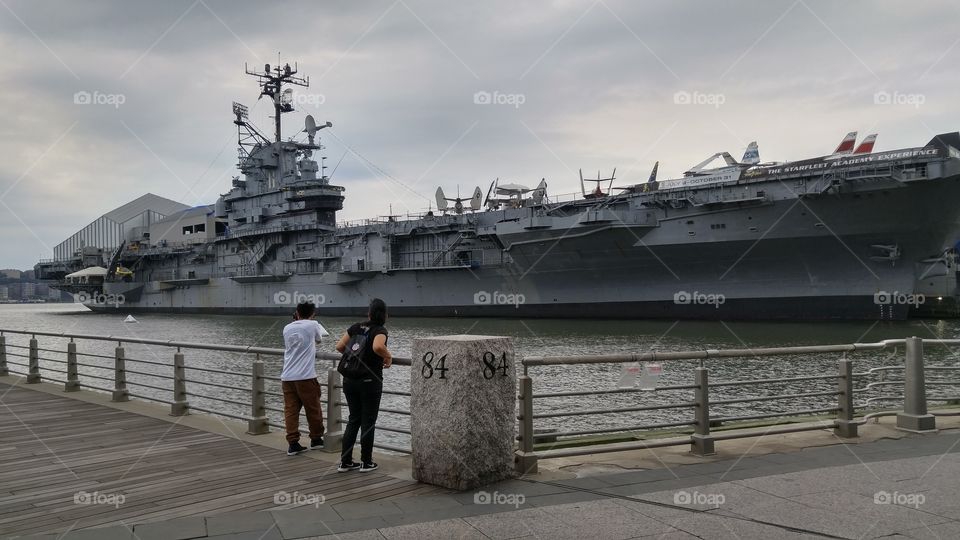 brother and sister taking a time off staring at the intrepid
