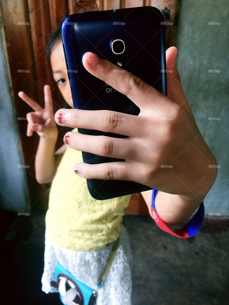 Little girl taking selfie