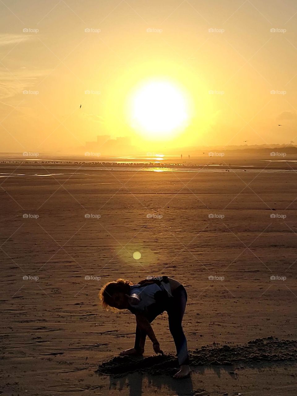 Girl on beach sunset