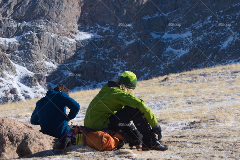 Two men rest during a high altitude hike.