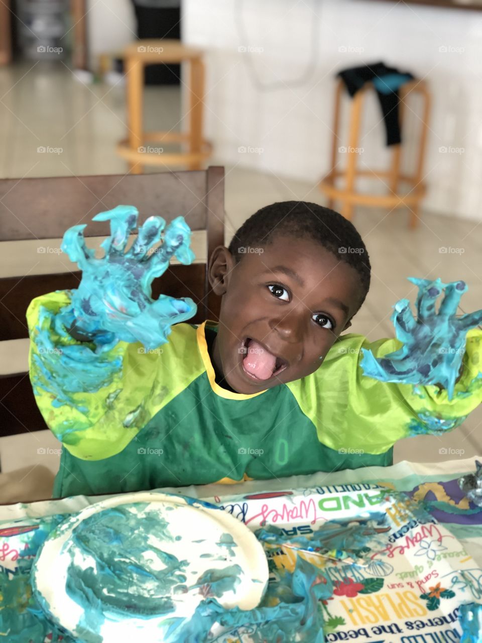 Child with messy hands art project