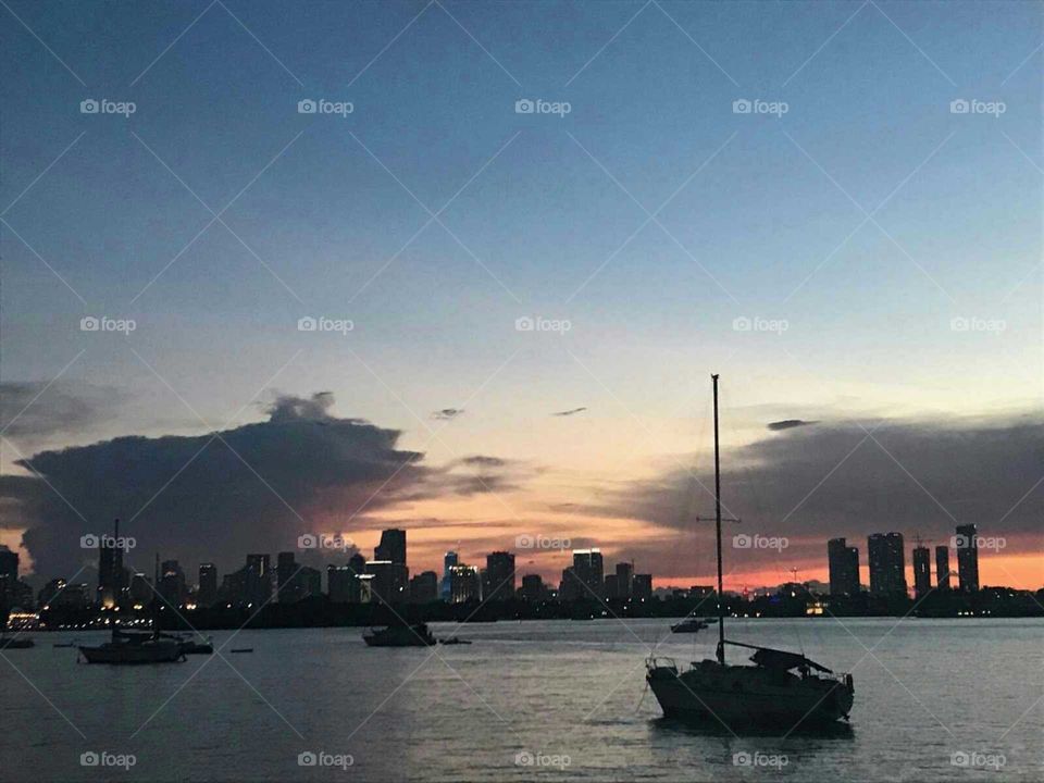 Sunset over the bay with the downtown Miami skyline in the background.