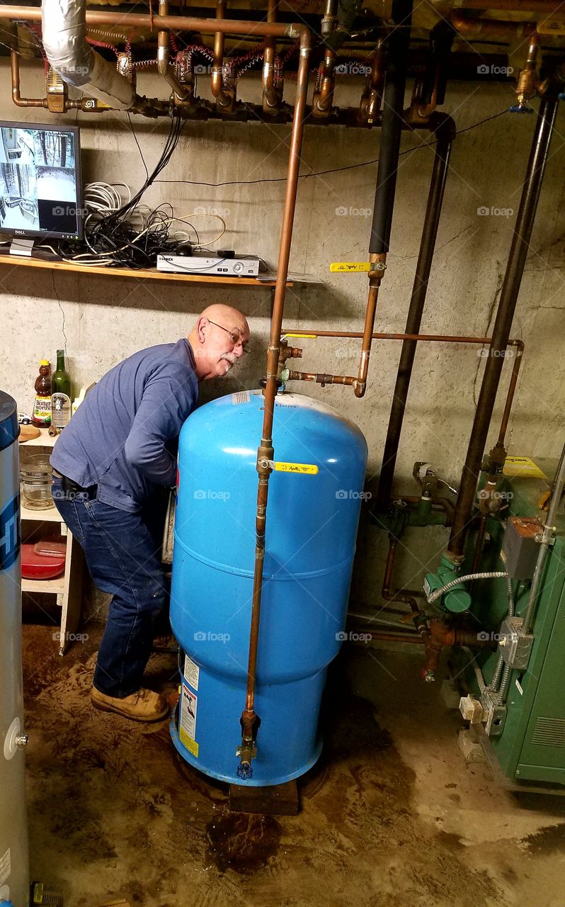 Working on water heating system.