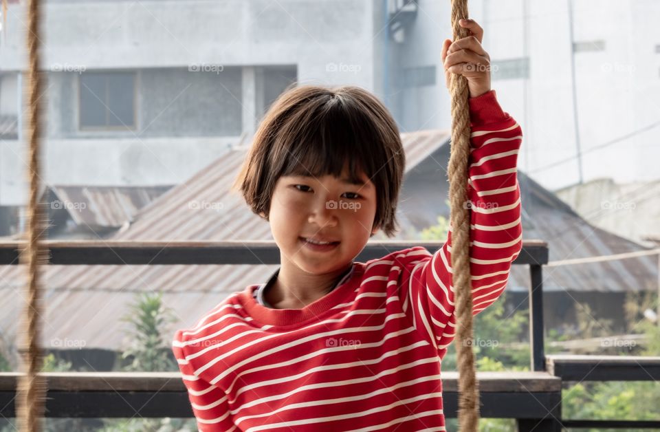 Cute girl play swing