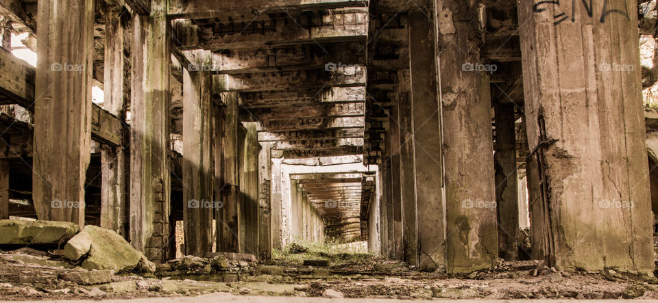 Old ruins. WWII old concret bombed ruins of the synthetic gasoline factory. Corridor.