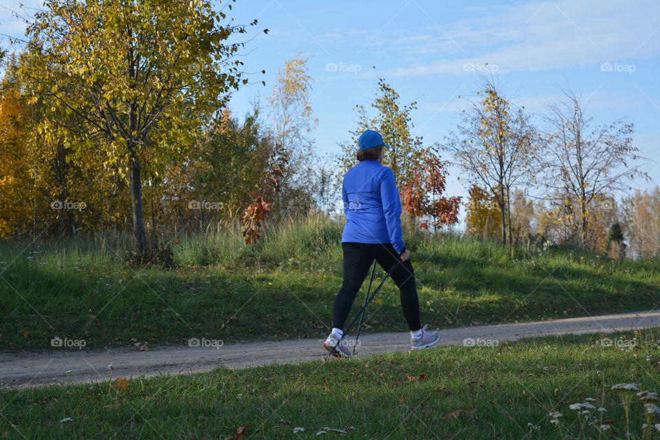 woman walking sport time autumn landscape, social distance