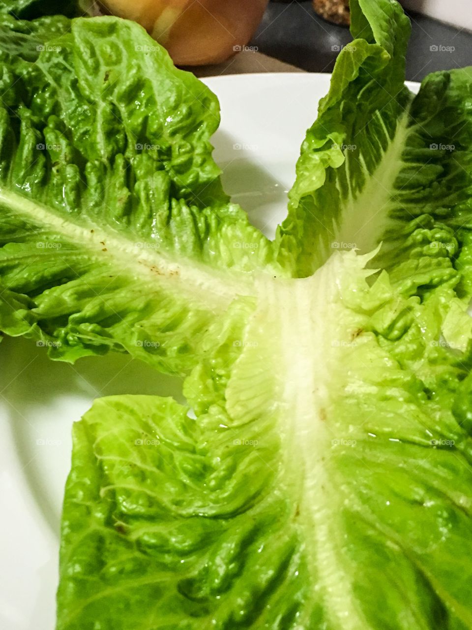 Lettuce leaves leaf on white plate for pork lettuce wraps Thai cuisine 