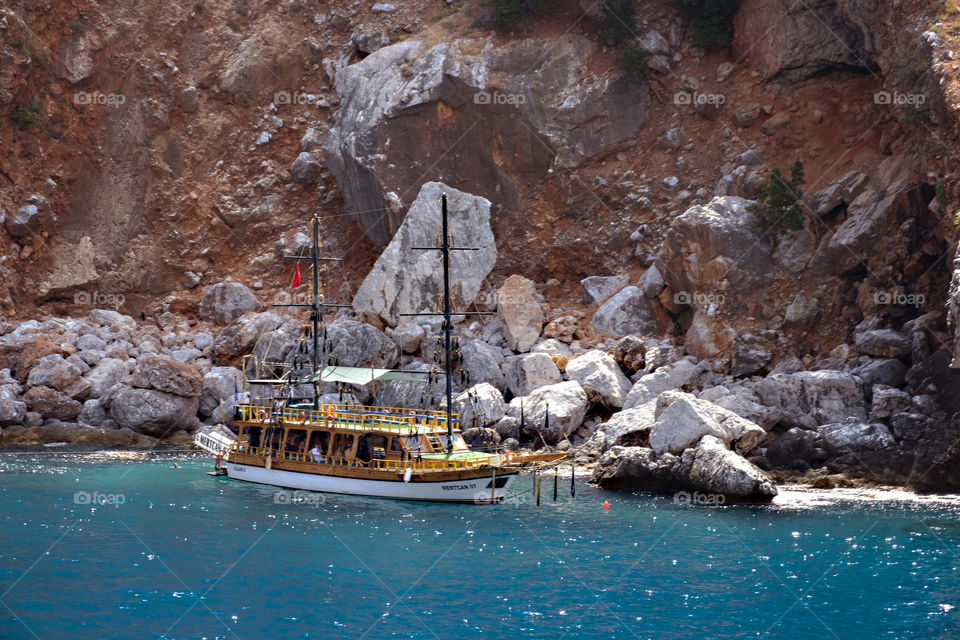 A ship in front of a mountain