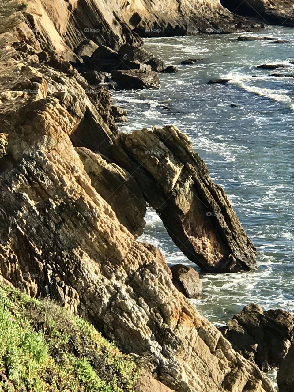 View of rock in sea
