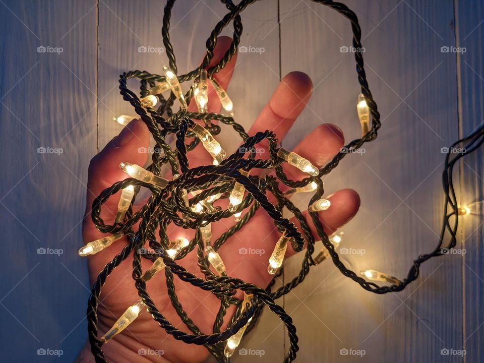 christmas garland in a man's hand