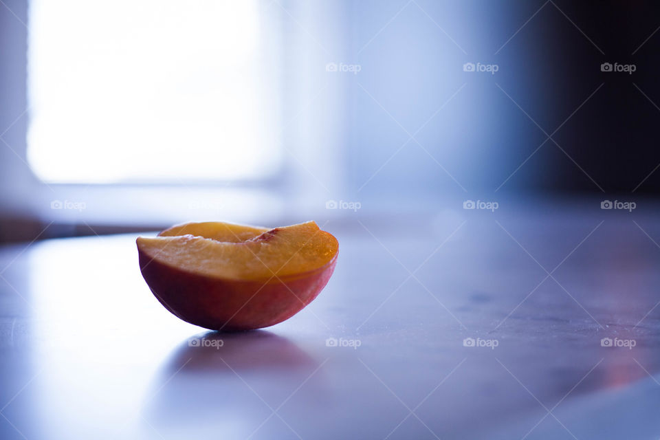 Peach half in half light