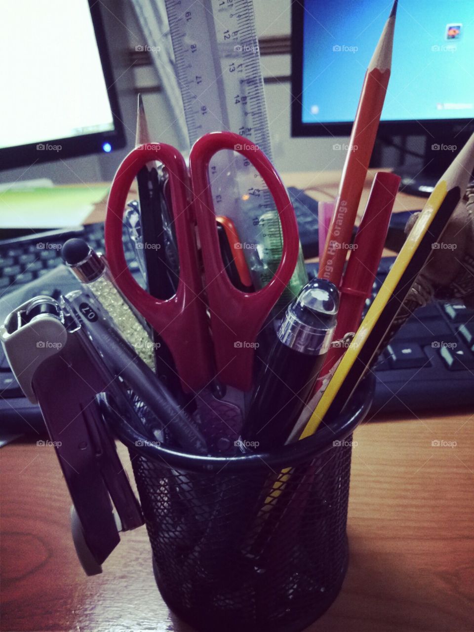 bouquet of pencils and pen in workstation