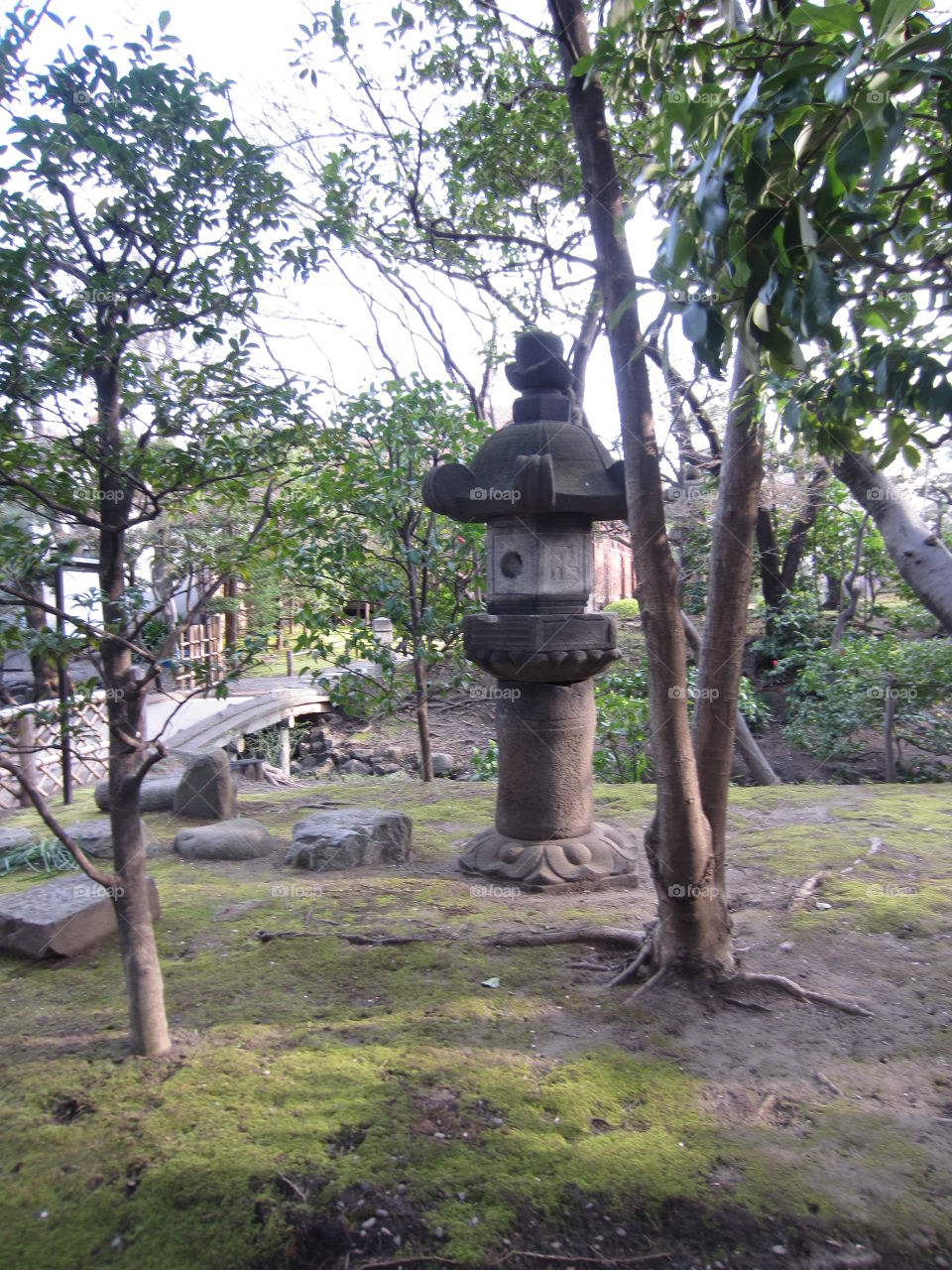 Asakusa Kannon, Tokyo, Japan. Bridge and Lantern on Sensoji Temple Grounds.  Trees in Springtime.  Traditional Buddhist Garden.