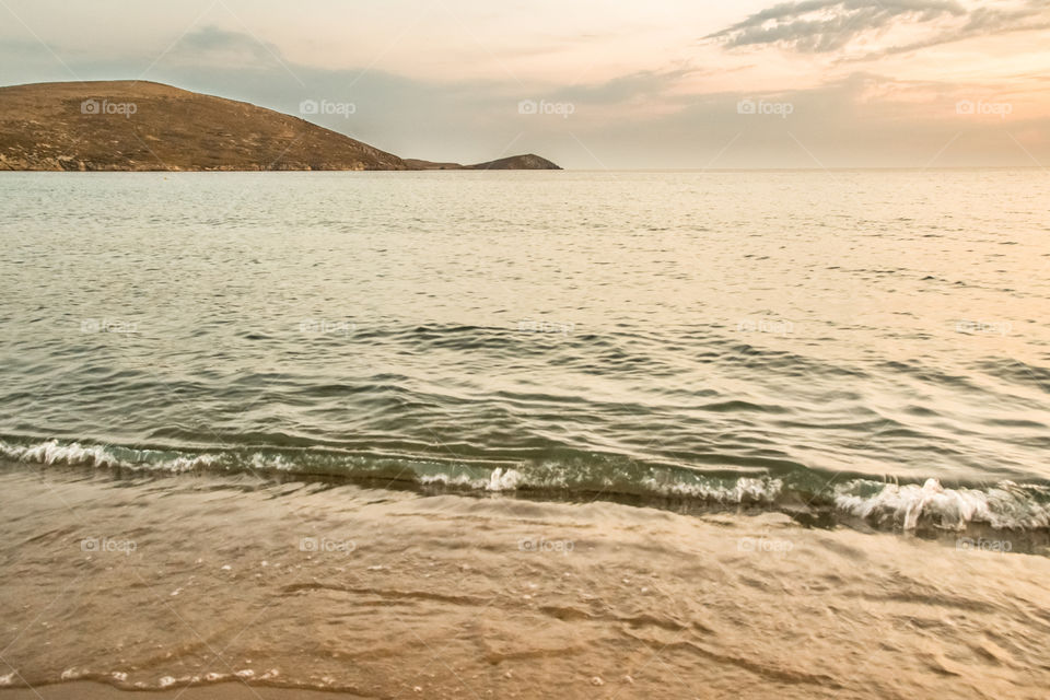 Sea Wave On The Sand Beach
