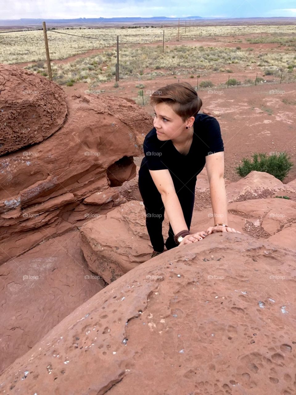 Girl Leaning on Desert Rock 