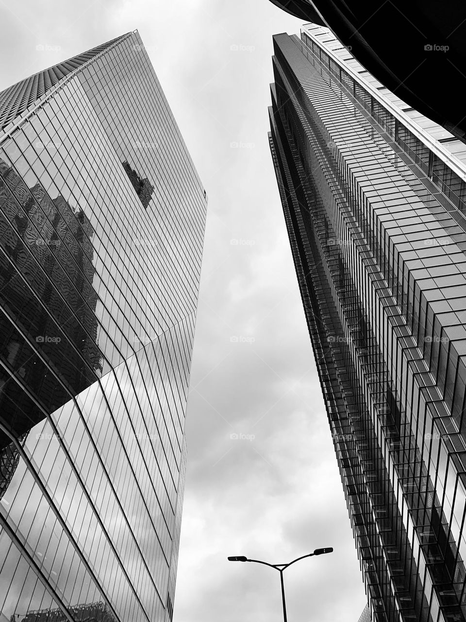 Modern crystal skyscrapers stand out in the London sky, photo from below